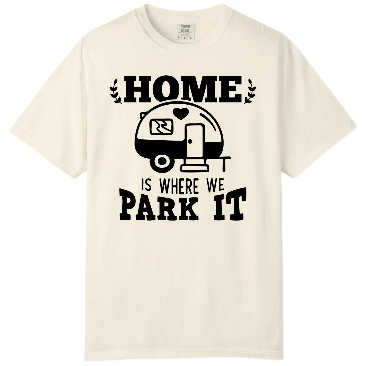 Vintage travel trailer illustration with 'Home Is Where We Park It' text and laurel wreaths on gray background in Ivory