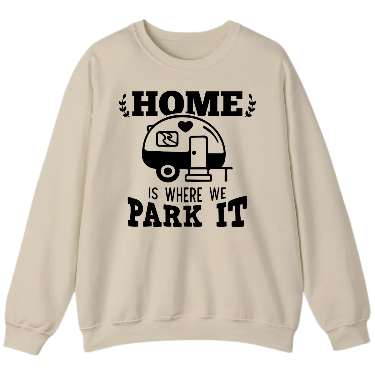 Vintage travel trailer illustration with 'Home Is Where We Park It' text and laurel wreaths on gray background in Sand