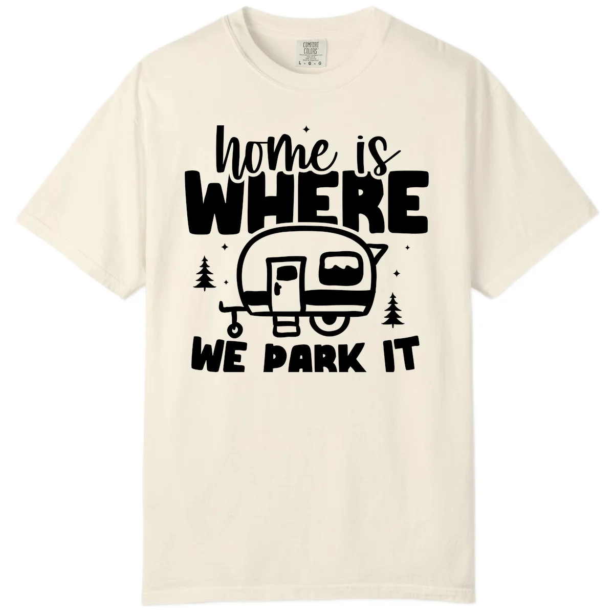 Retro-style design with 'home is where we park it' text and vintage travel trailer illustration surrounded by pine trees and sparkles in Ivory