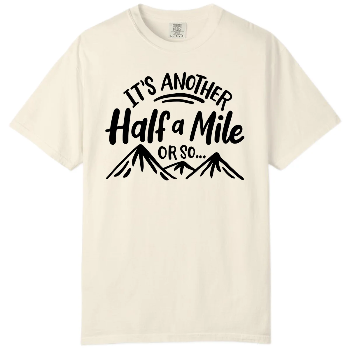 White text reading 'It's Another Half a Mile Or So...' with illustrated snow-capped mountains below on gray background in Ivory