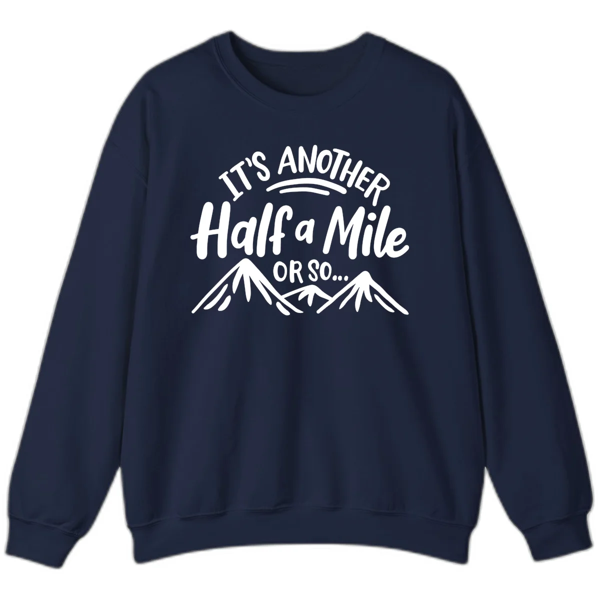 White text reading 'It's Another Half a Mile Or So...' with illustrated snow-capped mountains below on gray background in Navy