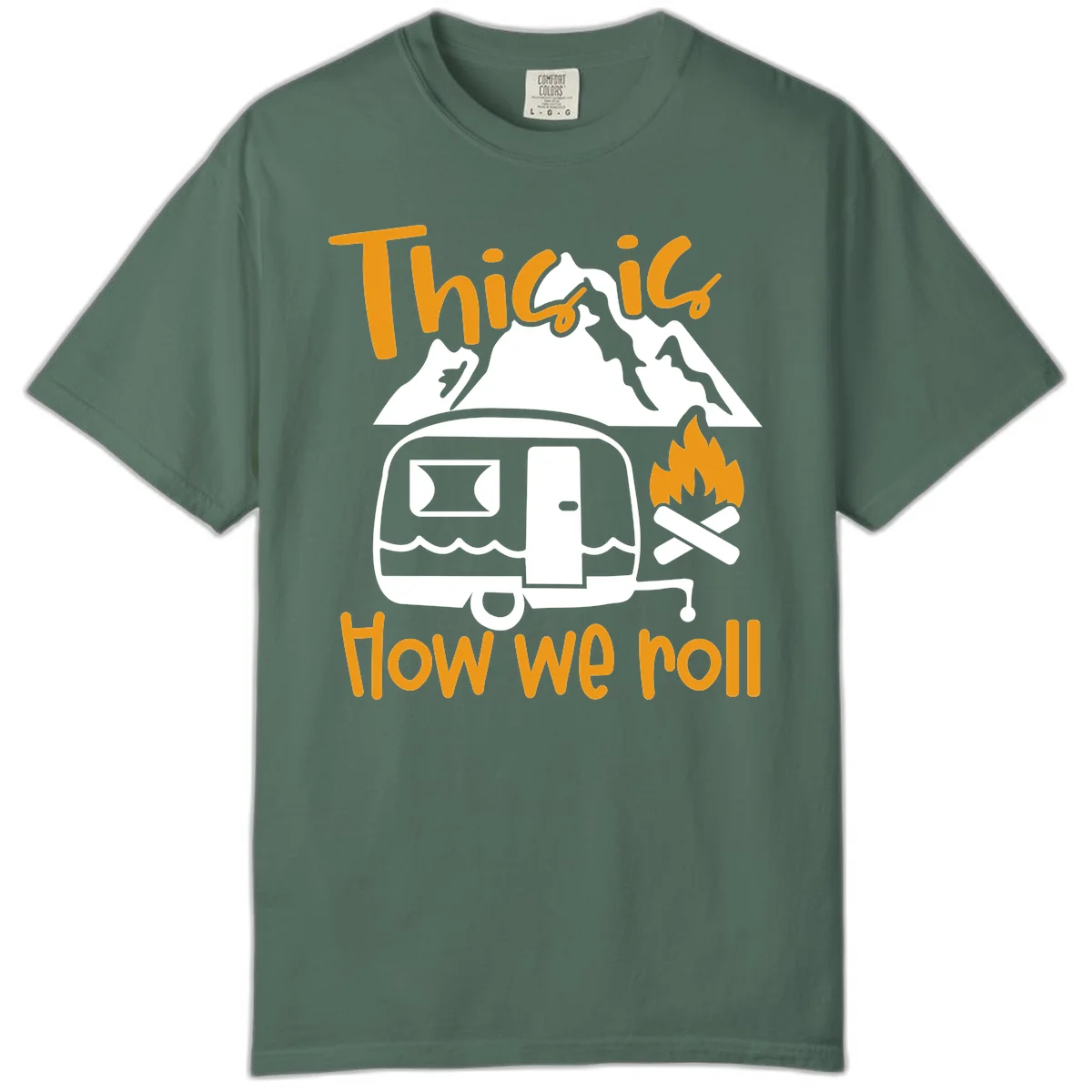 Vintage travel trailer with campfire and mountains, text reads 'This is how we roll' - camping lifestyle illustration in Blue Spruce