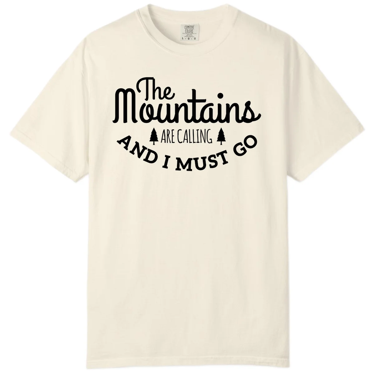 White text reading "The Mountains Are Calling And I Must Go" with pine trees on gray background in Ivory