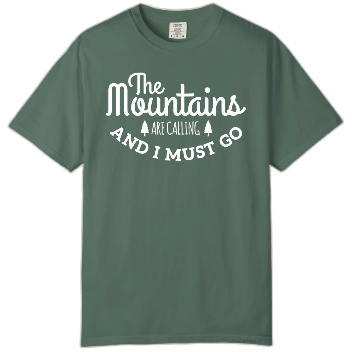 White text reading "The Mountains Are Calling And I Must Go" with pine trees on gray background in Blue Spruce