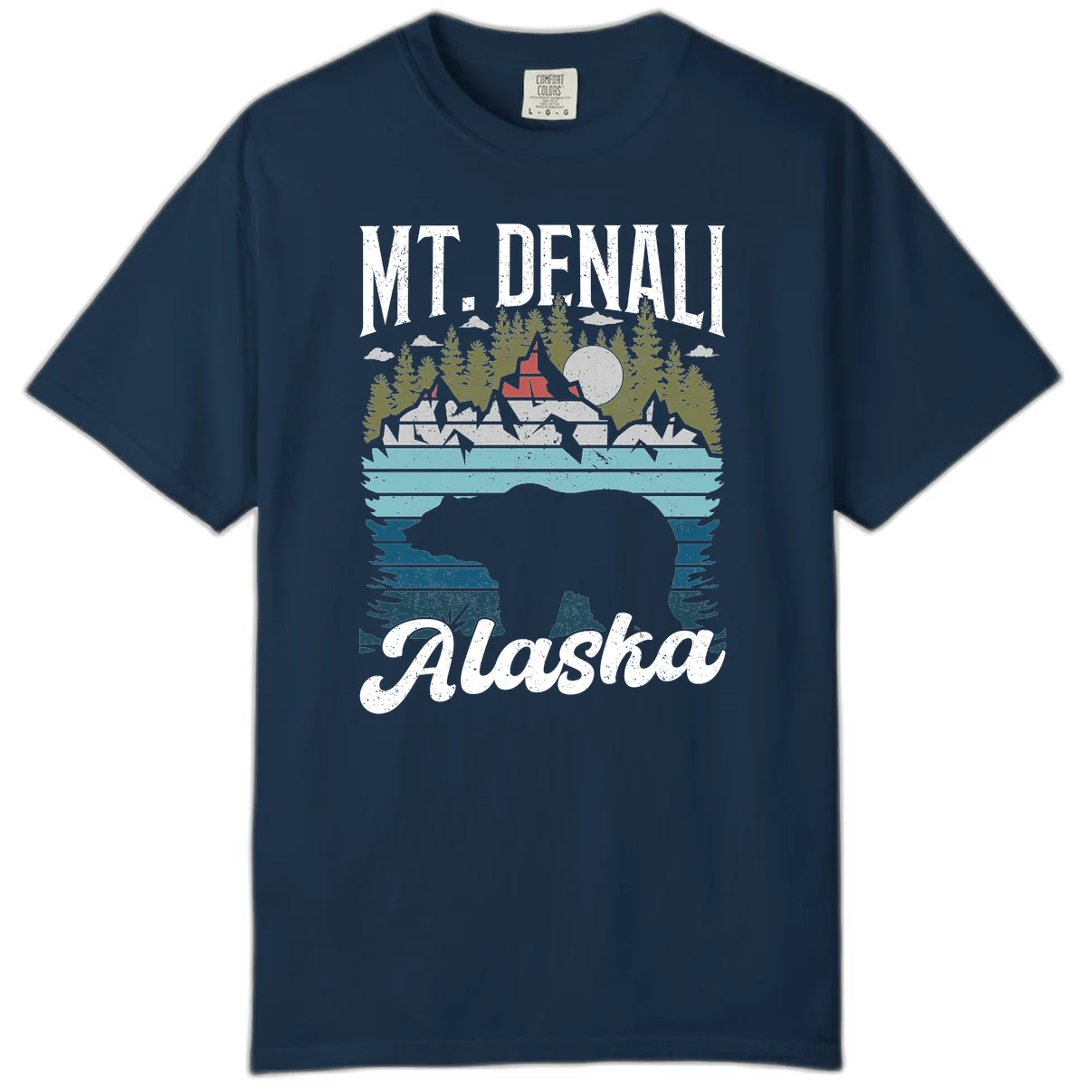 Denali bear Alaska design: layered illustration with silhouetted bear emerging from water, mountain peaks, fortress, forest, and full moon. in True Navy