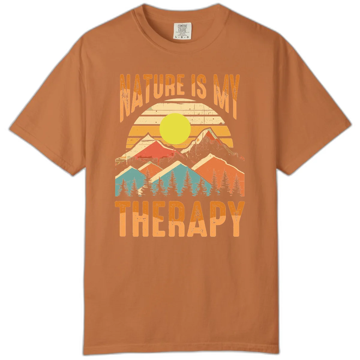 Vintage-style nature is my therapy design featuring layered mountains, sun, and forest with retro stripes and distressed texture in Yam