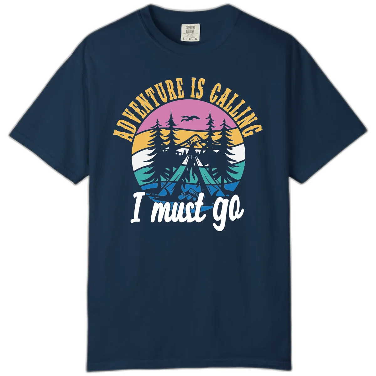 Circular badge with mountain landscape, evergreen trees, and flying birds in pink, gold, white, teal and blue with text 'Adventure Is Calling I Must Go' in True Navy