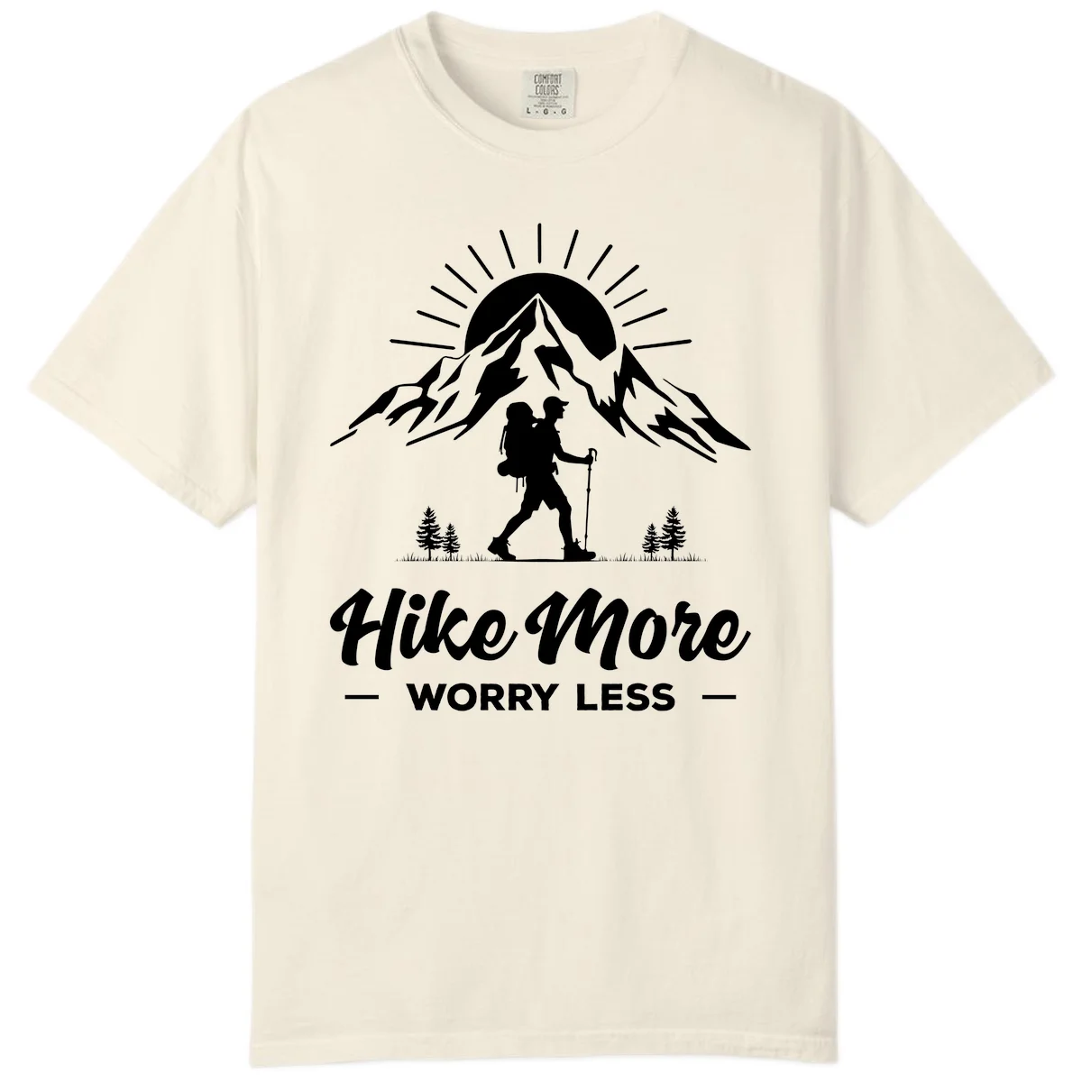 Silhouette of hiker with backpack and poles facing snow-capped mountain with radiating sun, evergreen trees below, text reads 'Hike More Worry Less' in Ivory