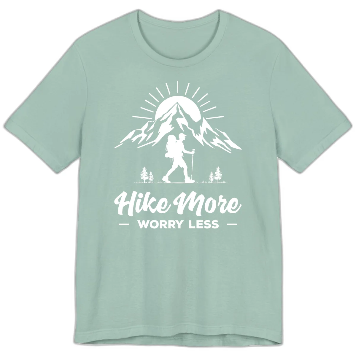 Silhouette of hiker with backpack and poles facing snow-capped mountain with radiating sun, evergreen trees below, text reads 'Hike More Worry Less' in Dusty Blue