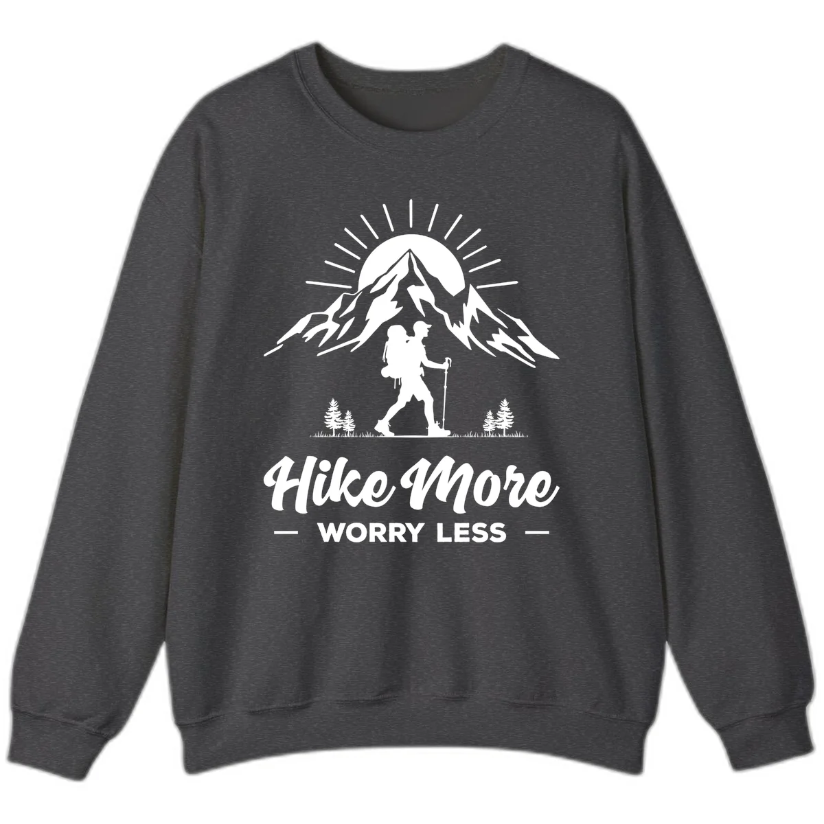 Silhouette of hiker with backpack and poles facing snow-capped mountain with radiating sun, evergreen trees below, text reads 'Hike More Worry Less' in Dark Heather