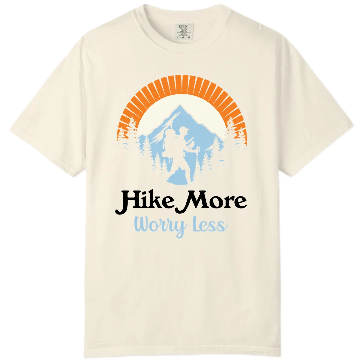 Hike more worry less badge design with silhouetted hiker, mountain peak, and evergreen forest in circular composition. in Ivory