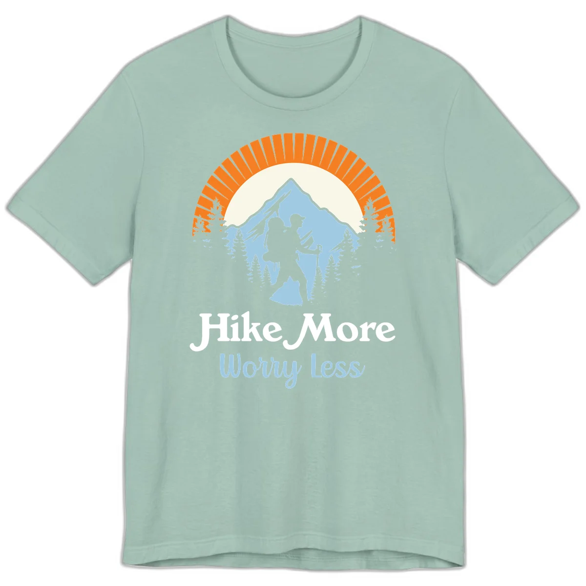 Hike more worry less badge design with silhouetted hiker, mountain peak, and evergreen forest in circular composition. in Dusty Blue