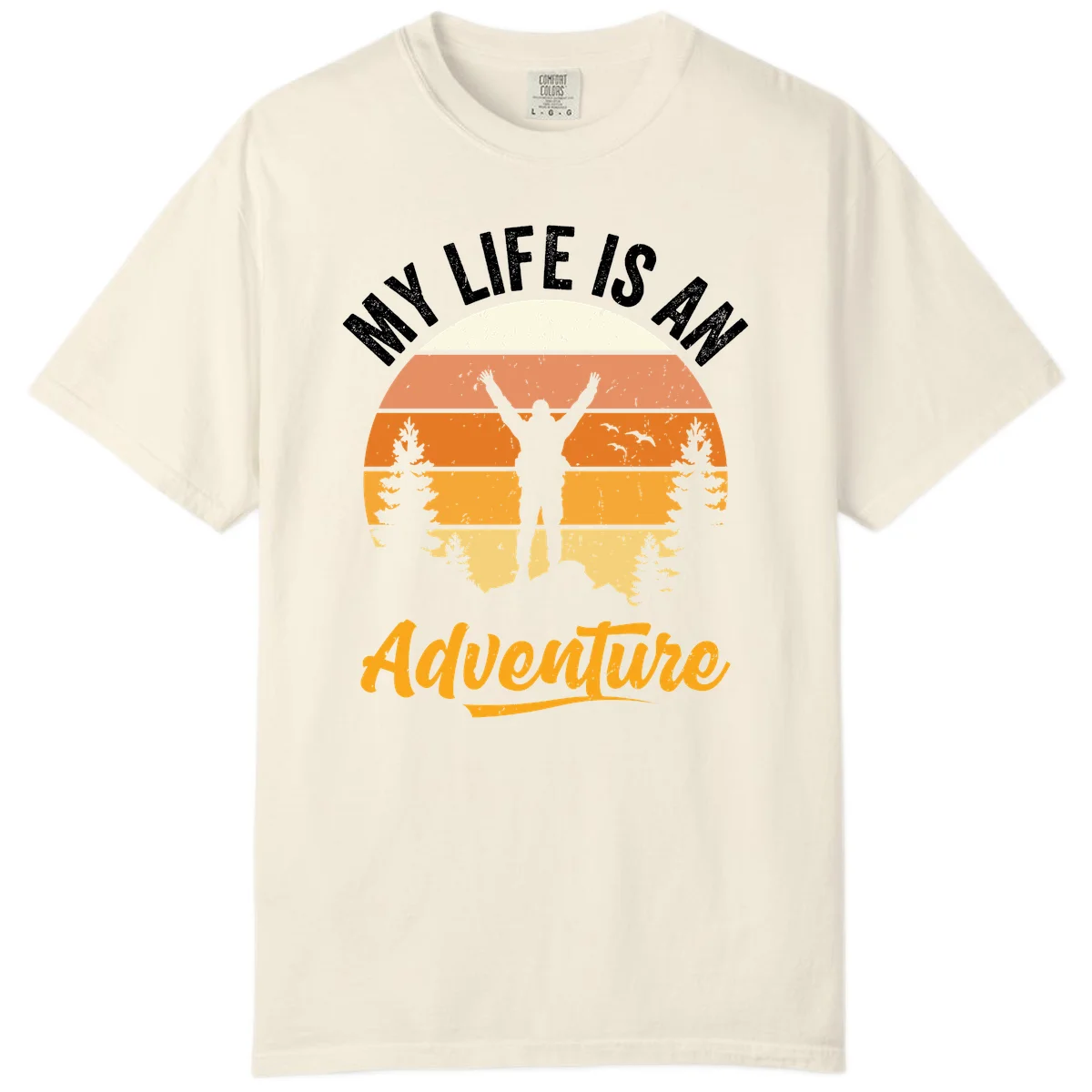Retro sunset illustration with silhouette of person celebrating arms raised, evergreen trees and mountains, text 'My Life Is An Adventure' in Ivory