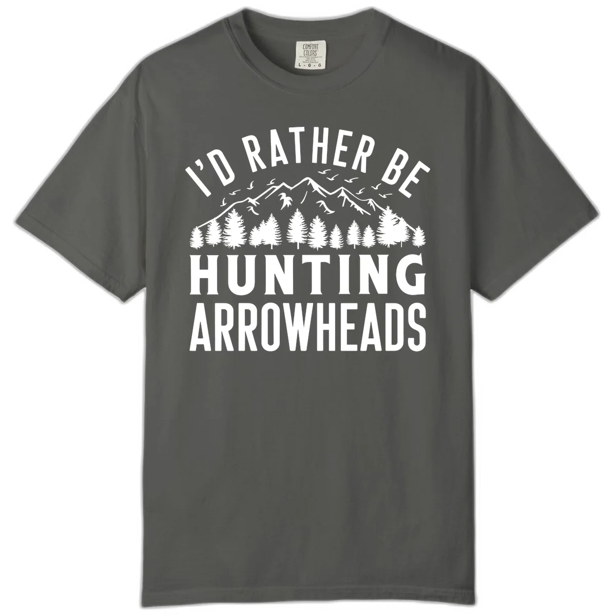 Mountain landscape with evergreen trees and birds, white text reading 'I'd Rather Be Hunting Arrowheads' on gray background in Pepper