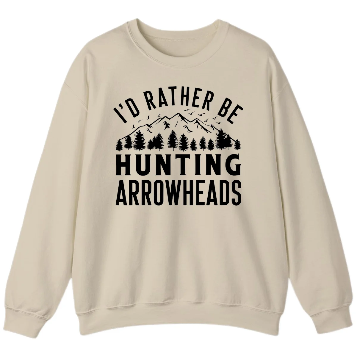 Mountain landscape with evergreen trees and birds, white text reading 'I'd Rather Be Hunting Arrowheads' on gray background in Sand