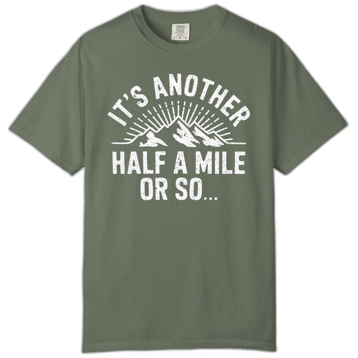 Retro distressed design with mountain peaks and sun rays, text reads 'It's Another Half A Mile Or So' - humorous hiking and camping artwork in Moss