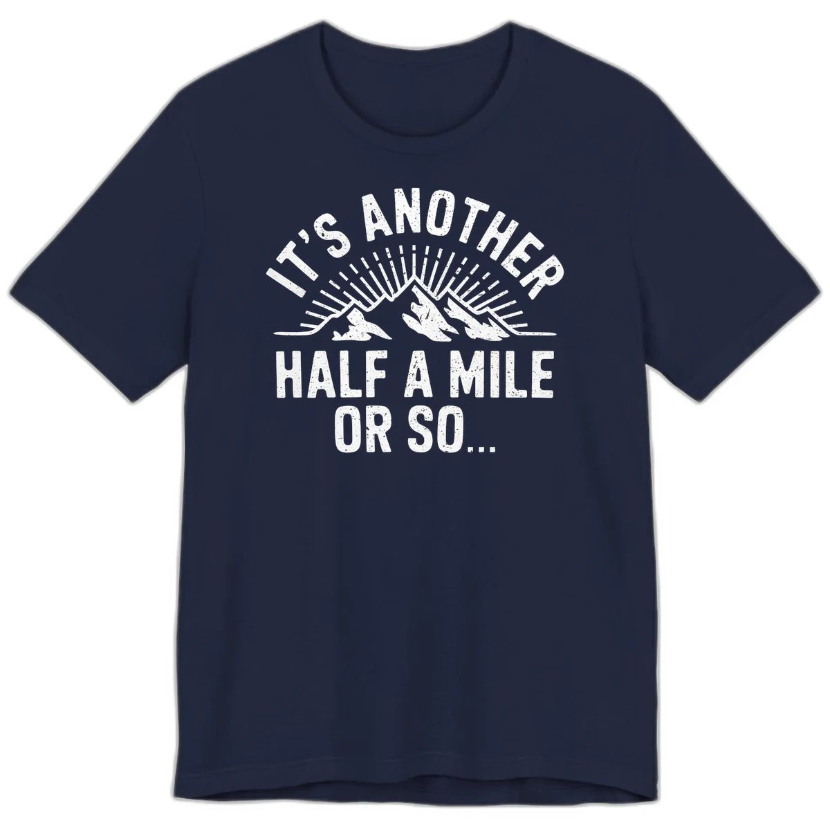 Retro distressed design with mountain peaks and sun rays, text reads 'It's Another Half A Mile Or So' - humorous hiking and camping artwork in Navy