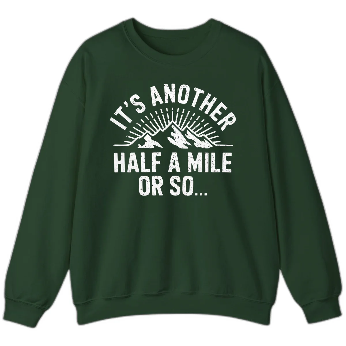 Retro distressed design with mountain peaks and sun rays, text reads 'It's Another Half A Mile Or So' - humorous hiking and camping artwork in Forest Green