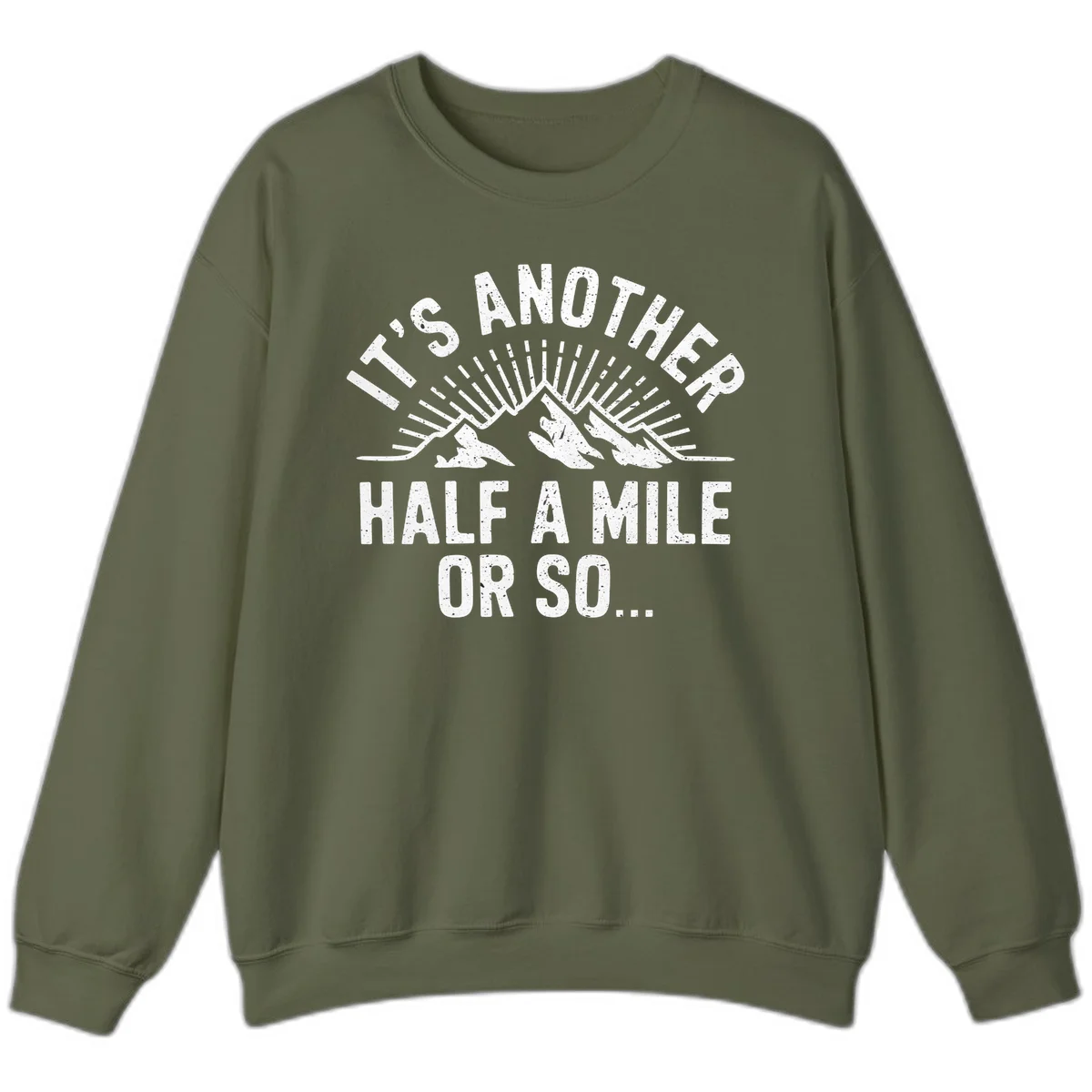 Retro distressed design with mountain peaks and sun rays, text reads 'It's Another Half A Mile Or So' - humorous hiking and camping artwork in Military Green