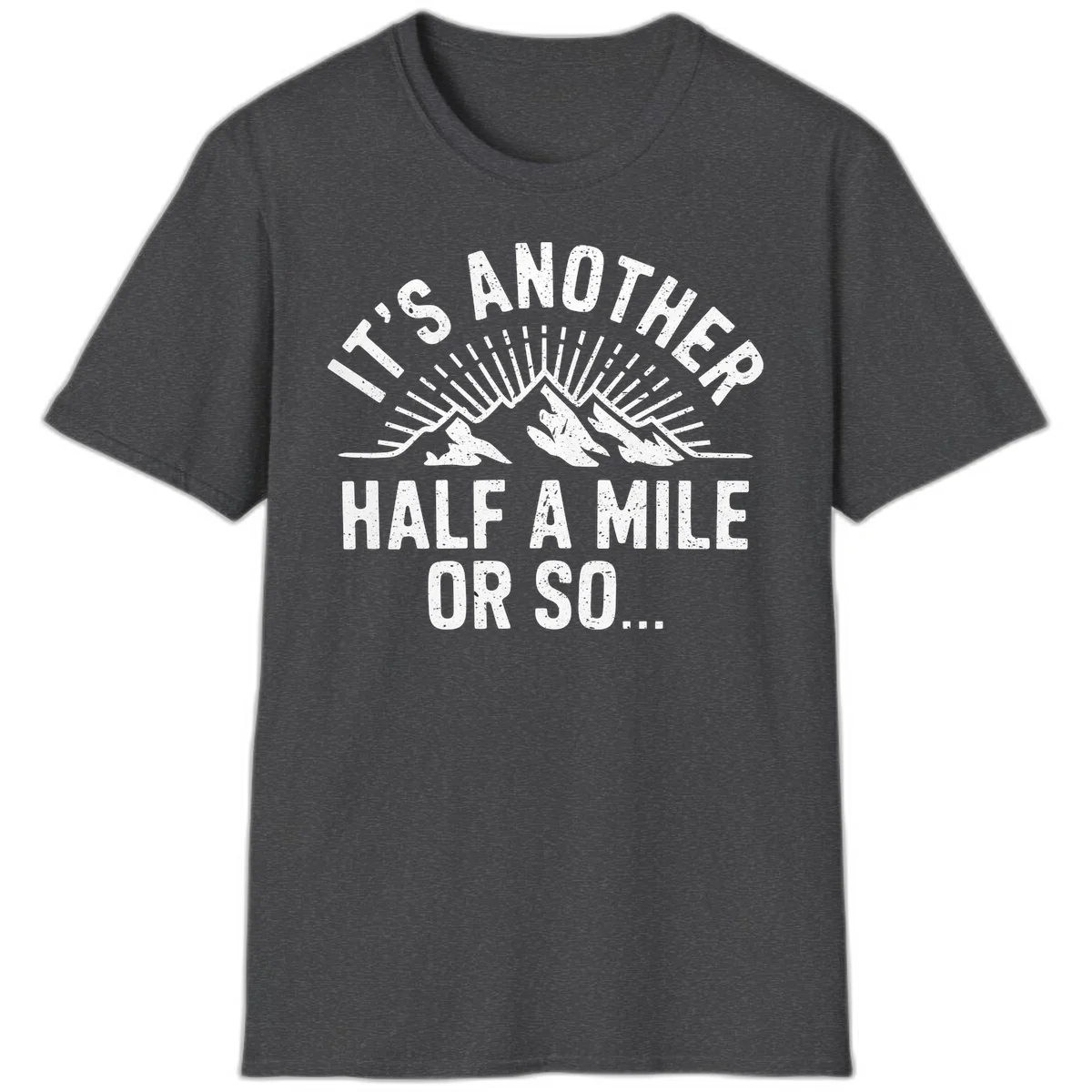 Retro distressed design with mountain peaks and sun rays, text reads 'It's Another Half A Mile Or So' - humorous hiking and camping artwork in Dark Heather