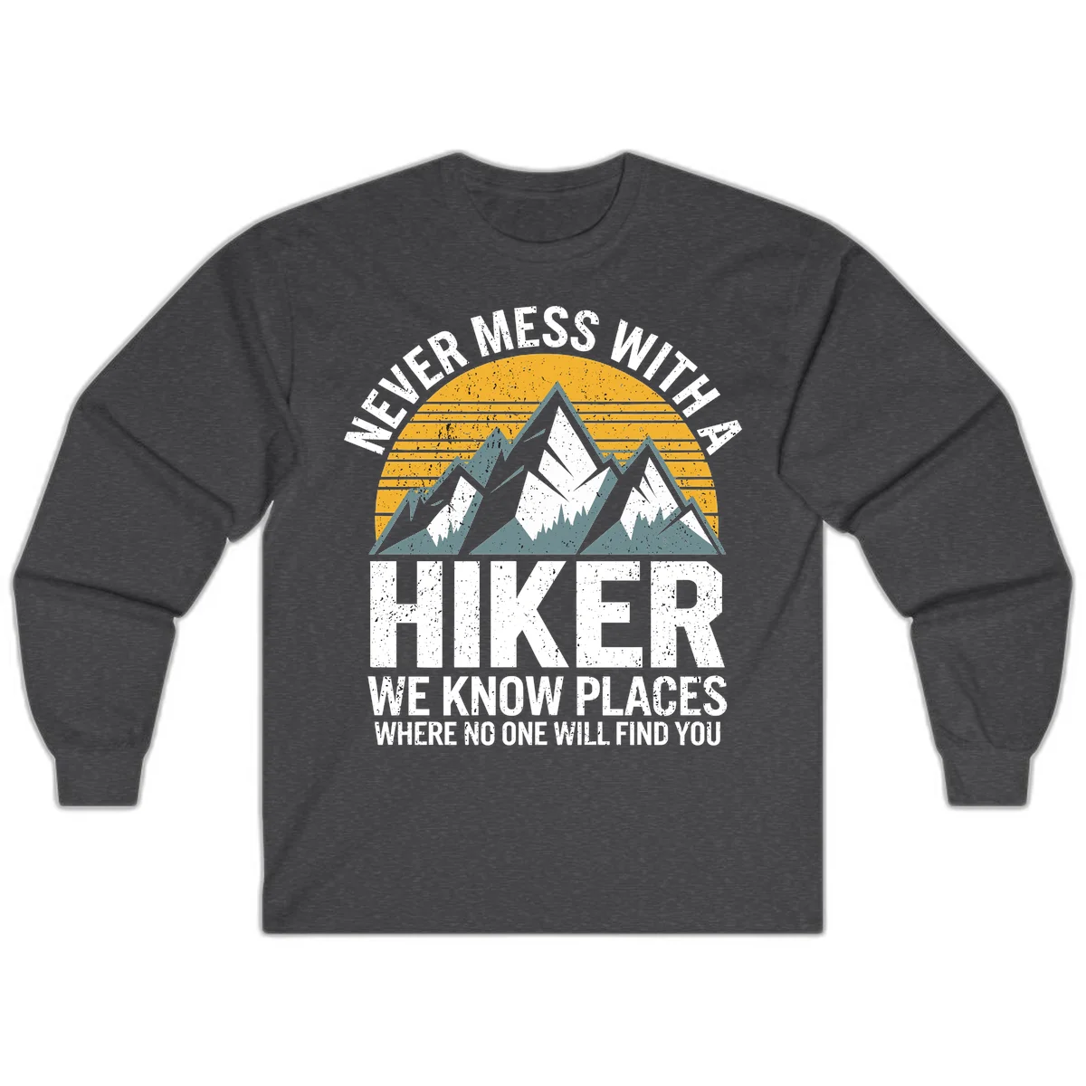 Vintage-style design with snow-capped mountains and forest silhouette against striped sunset, text reads 'Never Mess With A Hiker We Know Places Where No One Will Find You' in Dark Heather