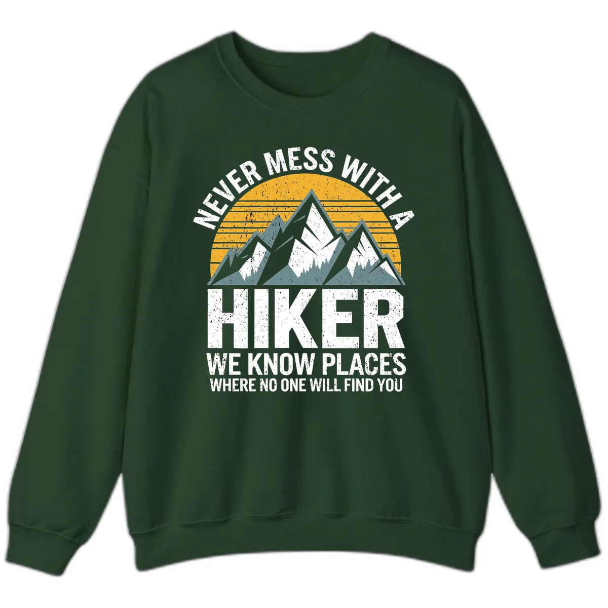 Vintage-style design with snow-capped mountains and forest silhouette against striped sunset, text reads 'Never Mess With A Hiker We Know Places Where No One Will Find You' in Forest Green