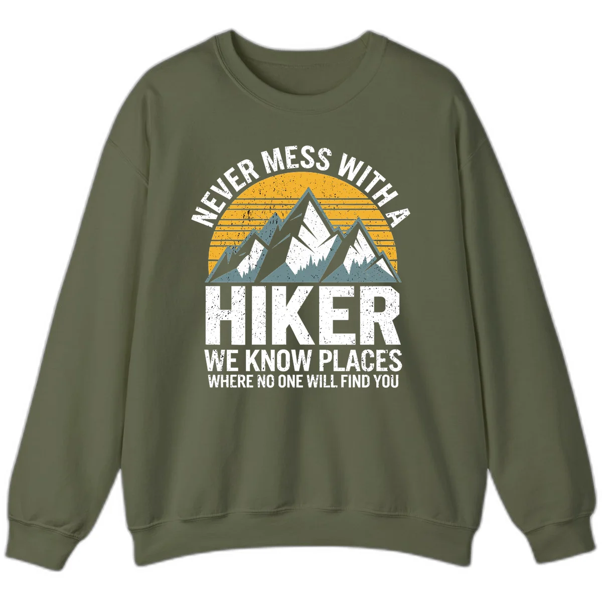 Vintage-style design with snow-capped mountains and forest silhouette against striped sunset, text reads 'Never Mess With A Hiker We Know Places Where No One Will Find You' in Military Green