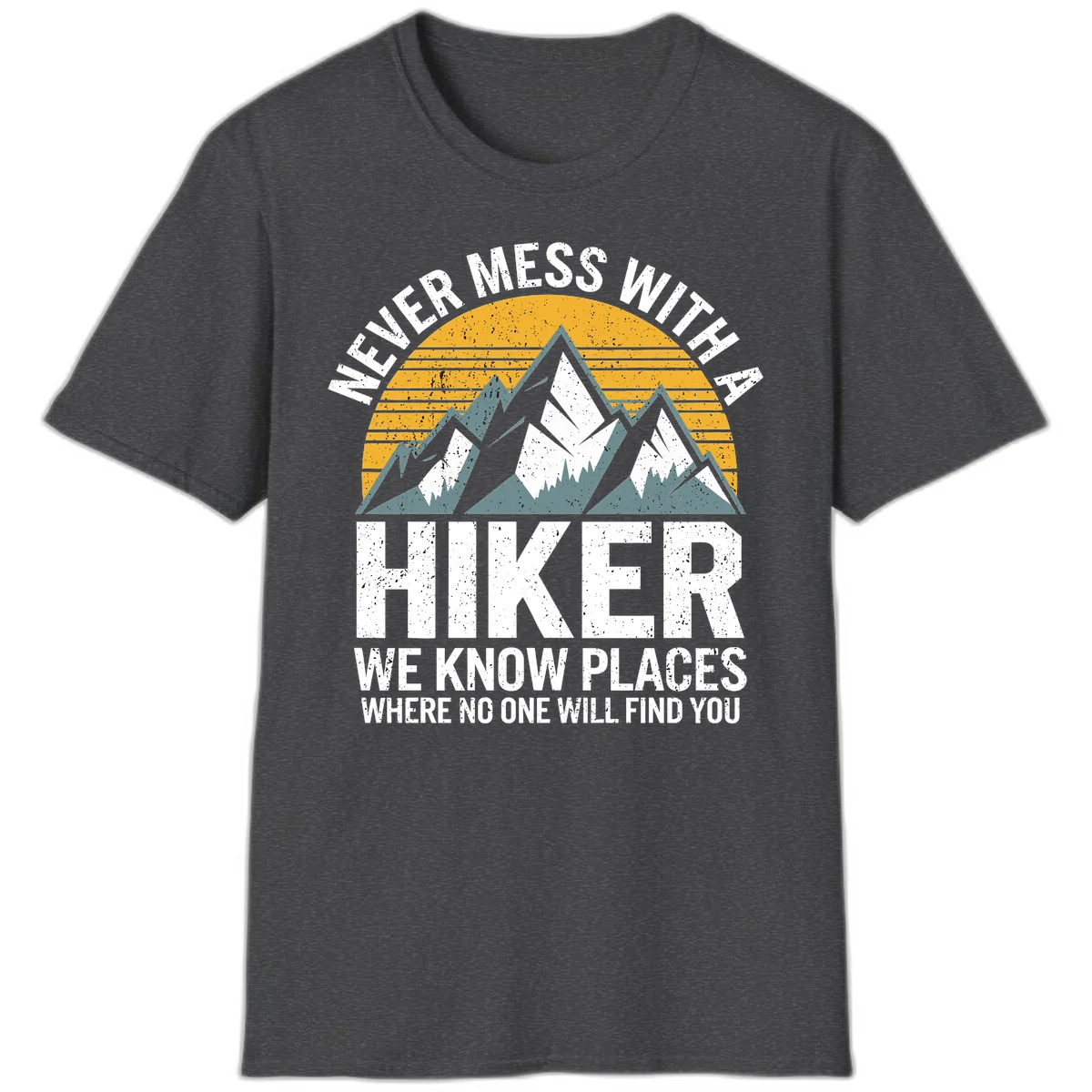 Vintage-style design with snow-capped mountains and forest silhouette against striped sunset, text reads 'Never Mess With A Hiker We Know Places Where No One Will Find You' in Dark Heather