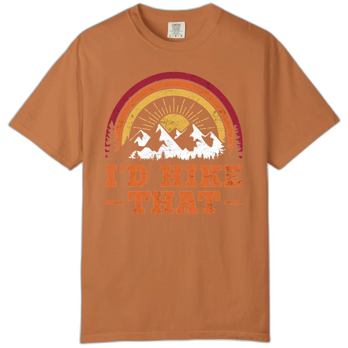 Vintage badge design with snow-capped mountains, evergreen trees, golden sun rays, and text reading 'I'd Hike That' in retro style in Yam