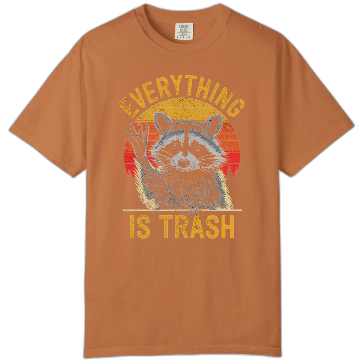 Vintage-style illustration of a raccoon with raised paw against retro sunset stripes, text reading 'Everything Is Trash' in distressed gold lettering in Yam