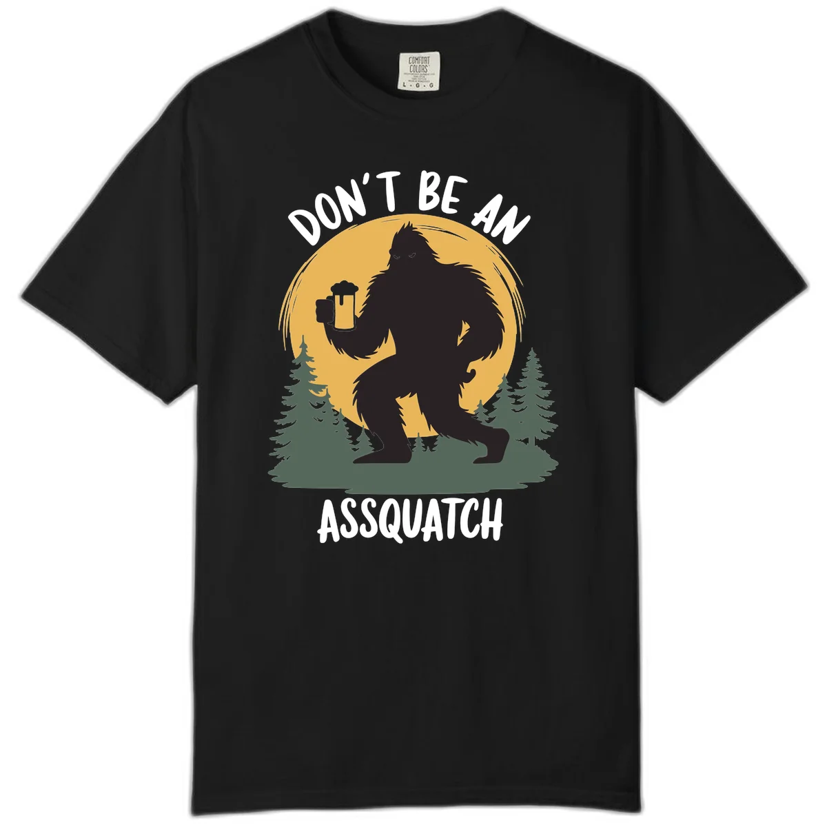 Black silhouette of Bigfoot holding a beer mug under a full moon with pine trees, text reads don't be an assquatch in Black