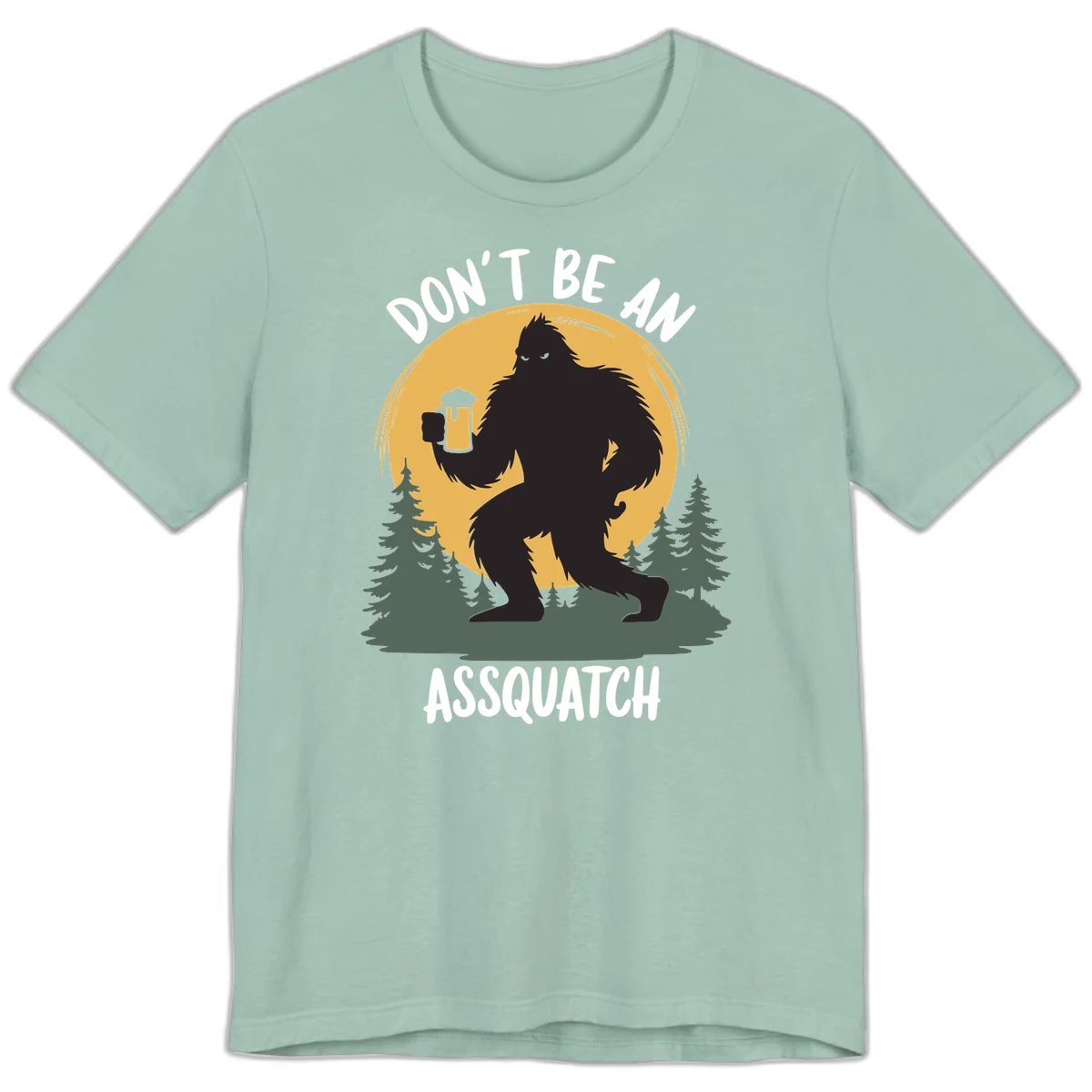 Black silhouette of Bigfoot holding a beer mug under a full moon with pine trees, text reads don't be an assquatch in Dusty Blue