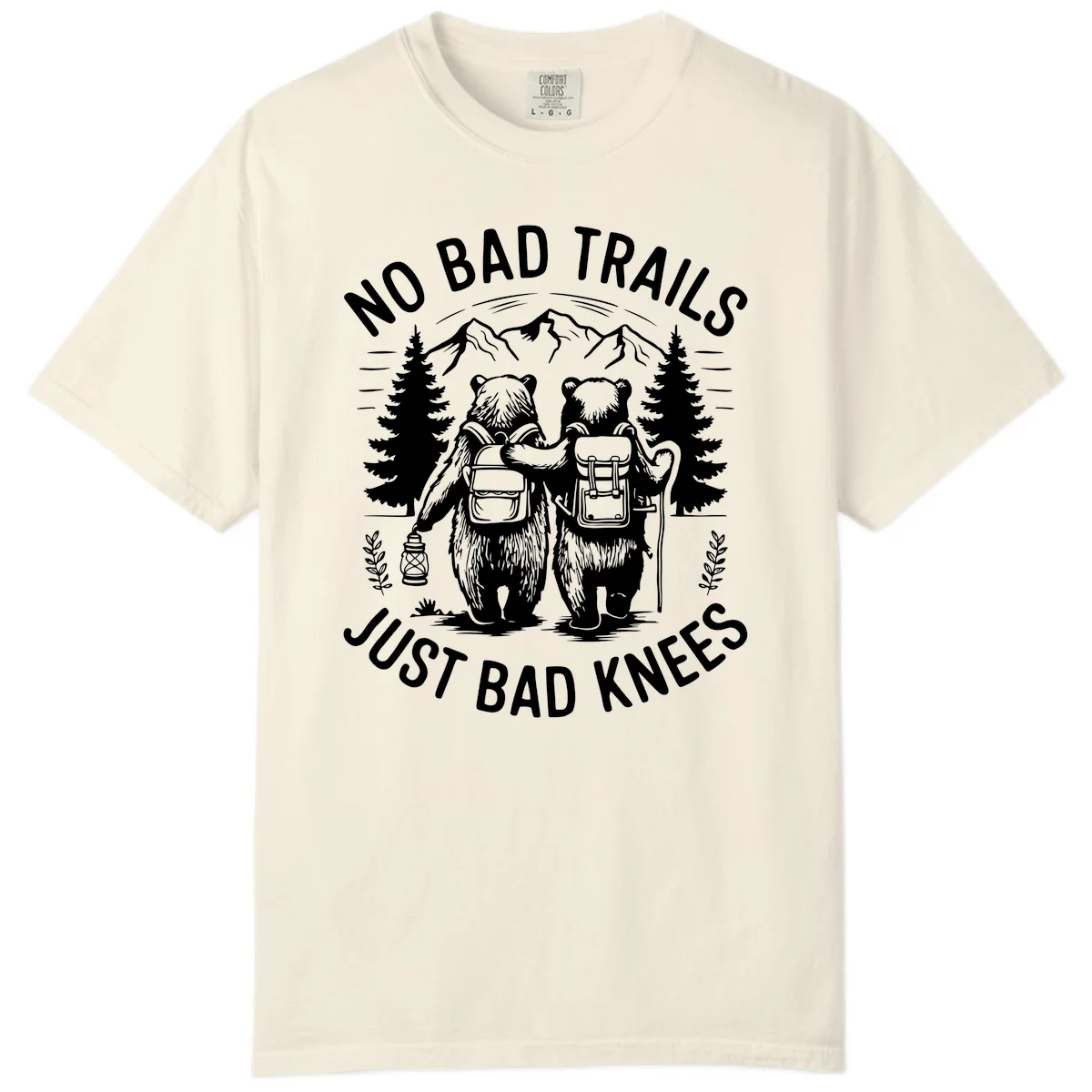 Two cartoon bears with backpacks hiking in mountains with text 'No Bad Trails Just Bad Knees' - humorous outdoor camping design in Ivory