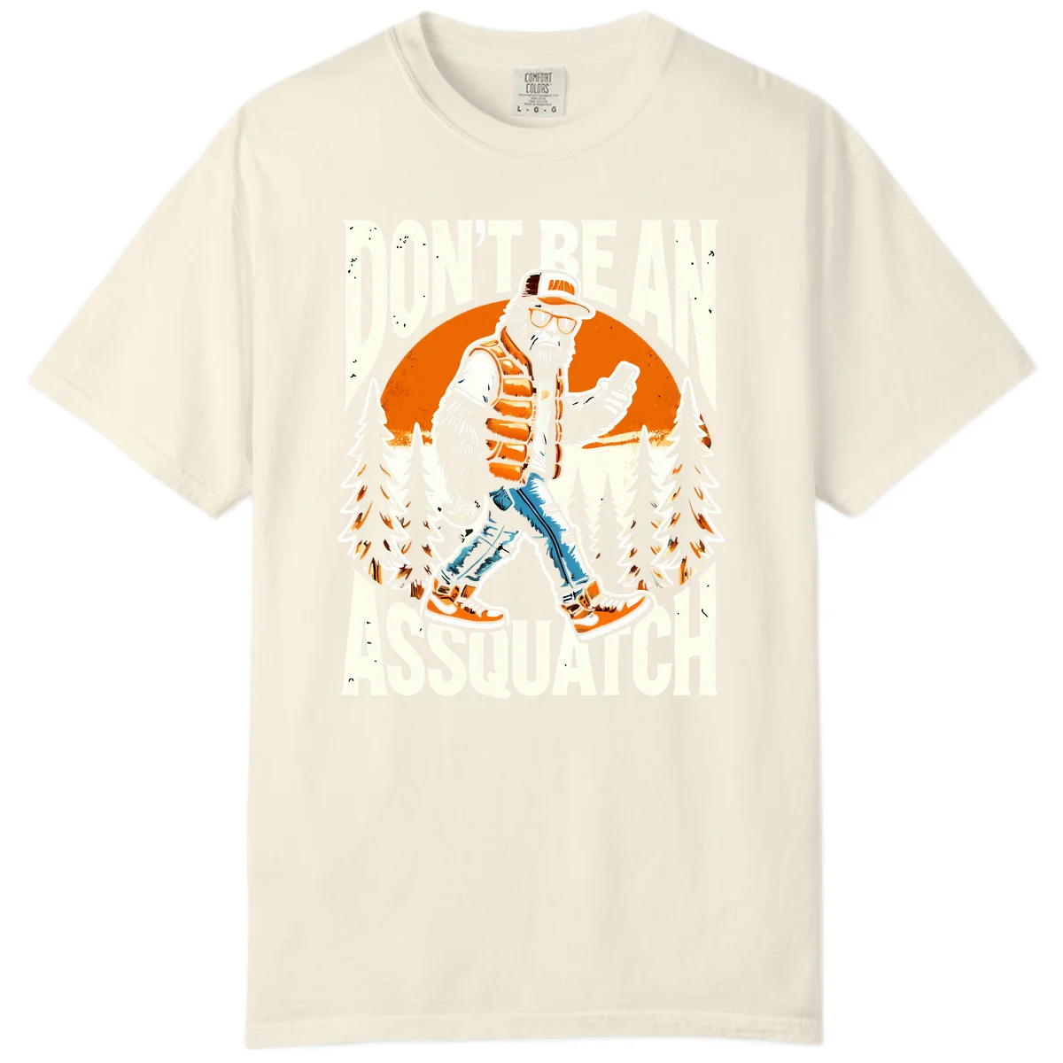 Cartoon sasquatch in hiking gear with backpack and smartphone, 'Don't Be An Assquatch' text, forest and orange sun background. in Ivory
