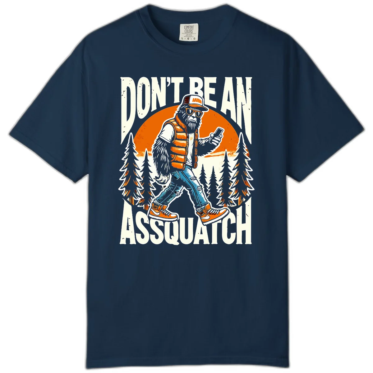 Cartoon sasquatch in hiking gear with backpack and smartphone, 'Don't Be An Assquatch' text, forest and orange sun background. in True Navy