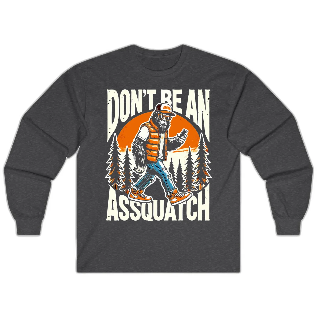 Cartoon sasquatch in hiking gear with backpack and smartphone, 'Don't Be An Assquatch' text, forest and orange sun background. in Dark Heather