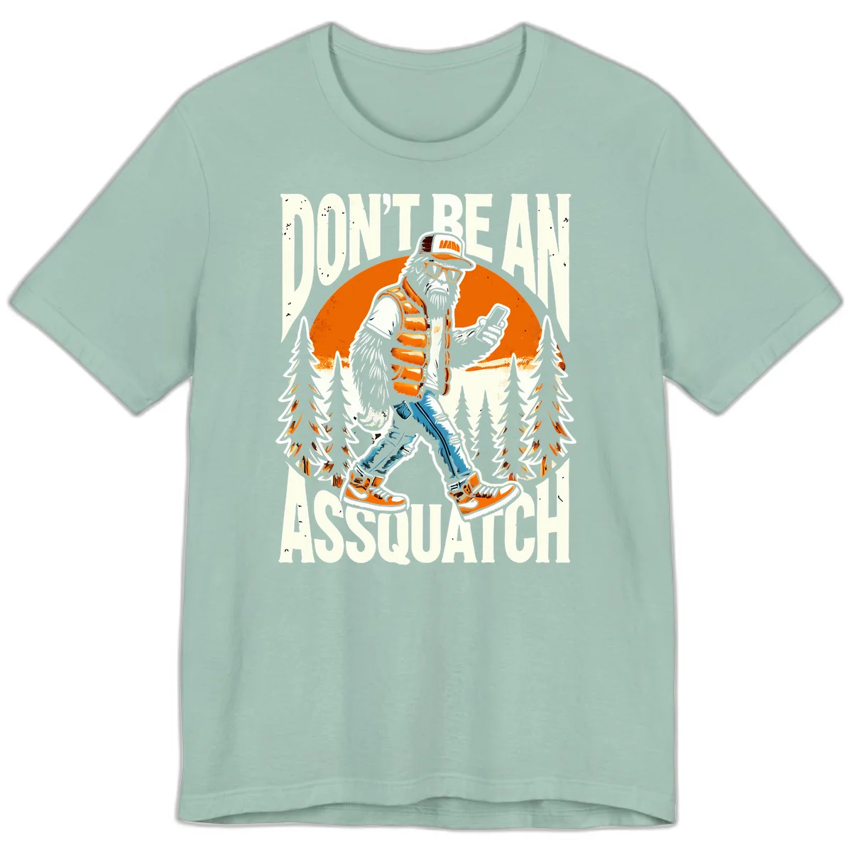 Cartoon sasquatch in hiking gear with backpack and smartphone, 'Don't Be An Assquatch' text, forest and orange sun background. in Dusty Blue