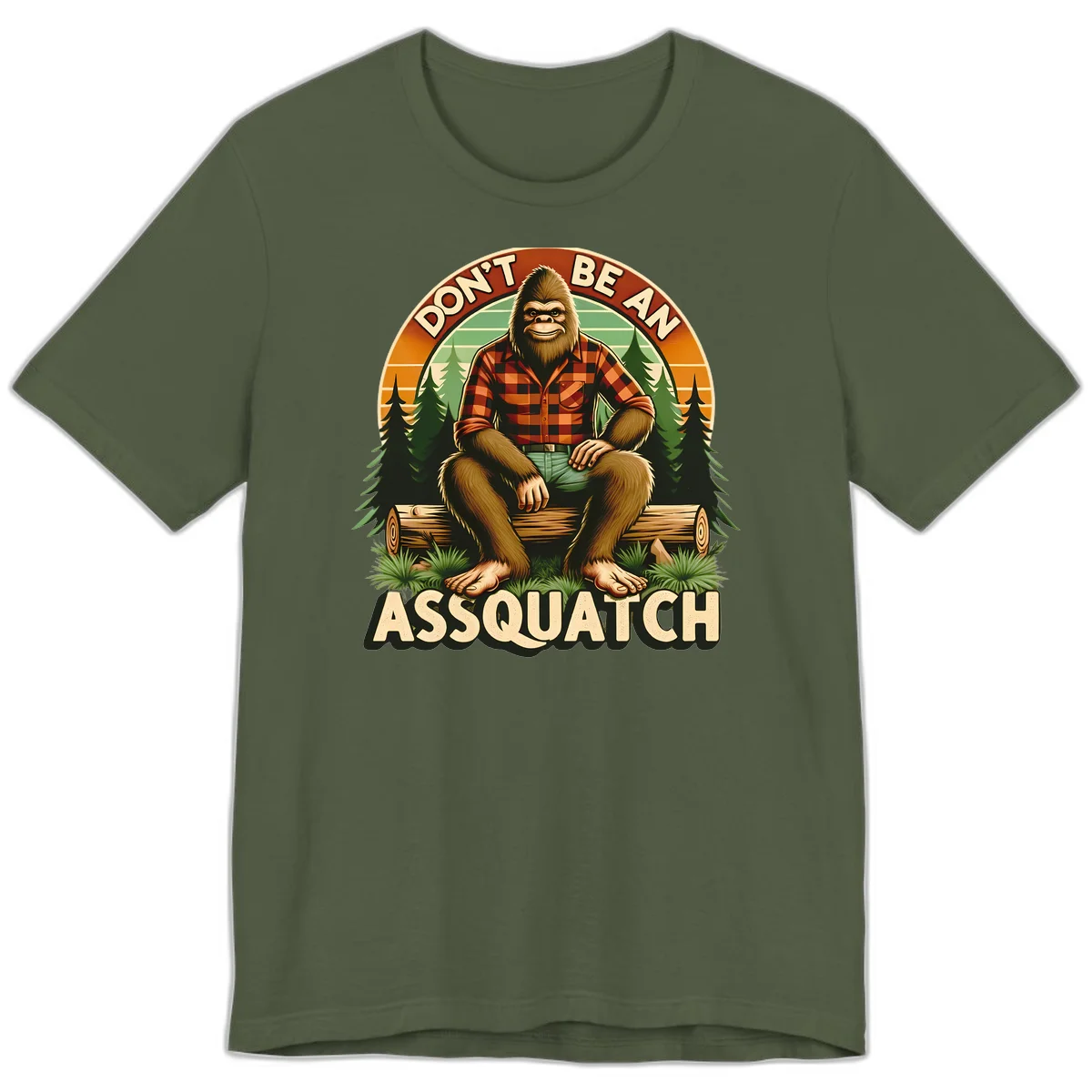 Vintage badge design with friendly Bigfoot in plaid shirt sitting on a log with forest trees, text reads 'Don't Be An Assquatch' in Military Green