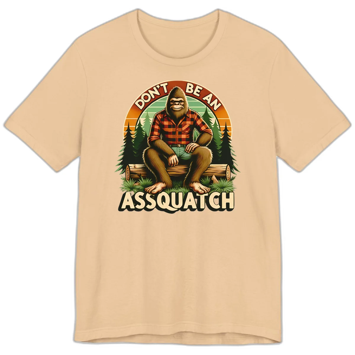 Vintage badge design with friendly Bigfoot in plaid shirt sitting on a log with forest trees, text reads 'Don't Be An Assquatch' in Sand Dune