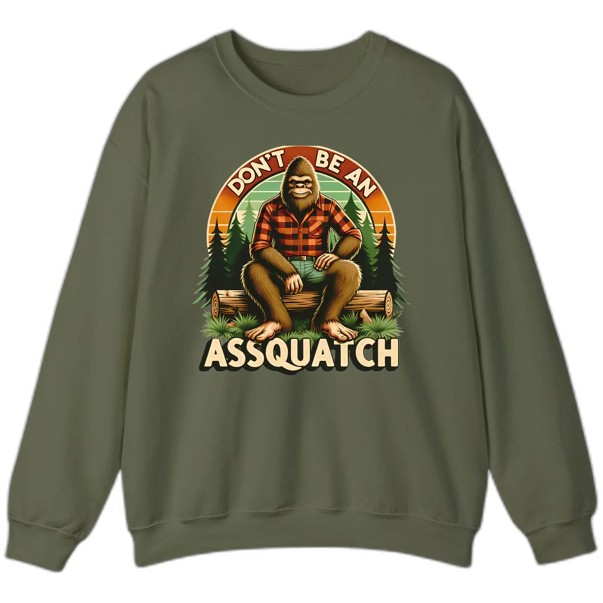Vintage badge design with friendly Bigfoot in plaid shirt sitting on a log with forest trees, text reads 'Don't Be An Assquatch' in Military Green