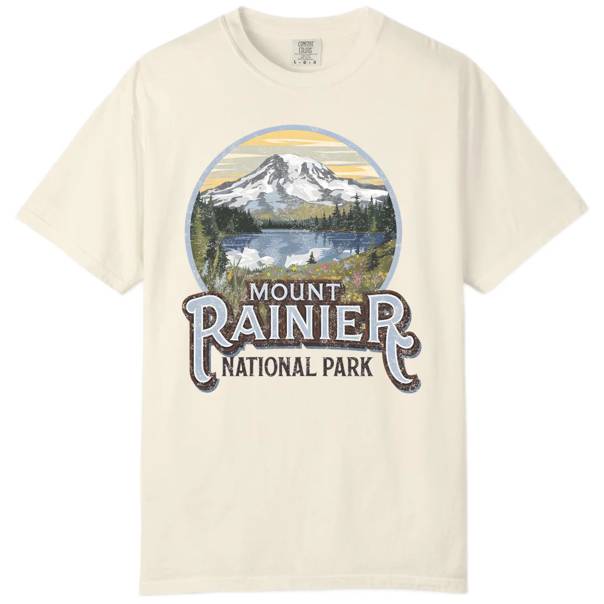 Vintage Mount Rainier National Park badge design with snow-capped peak, alpine lake, evergreen forest, and wildflowers on distressed background in Ivory
