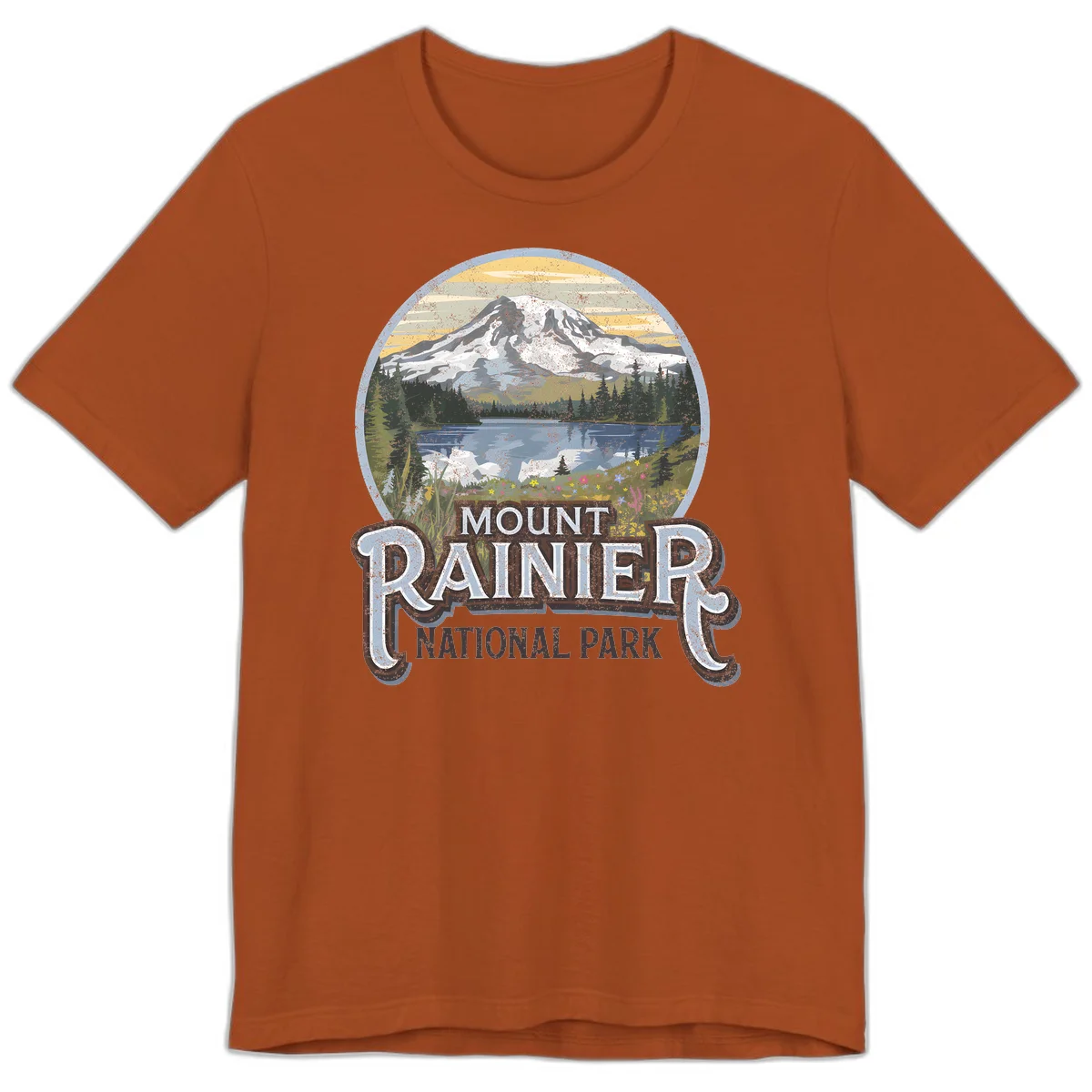Vintage Mount Rainier National Park badge design with snow-capped peak, alpine lake, evergreen forest, and wildflowers on distressed background in Autumn