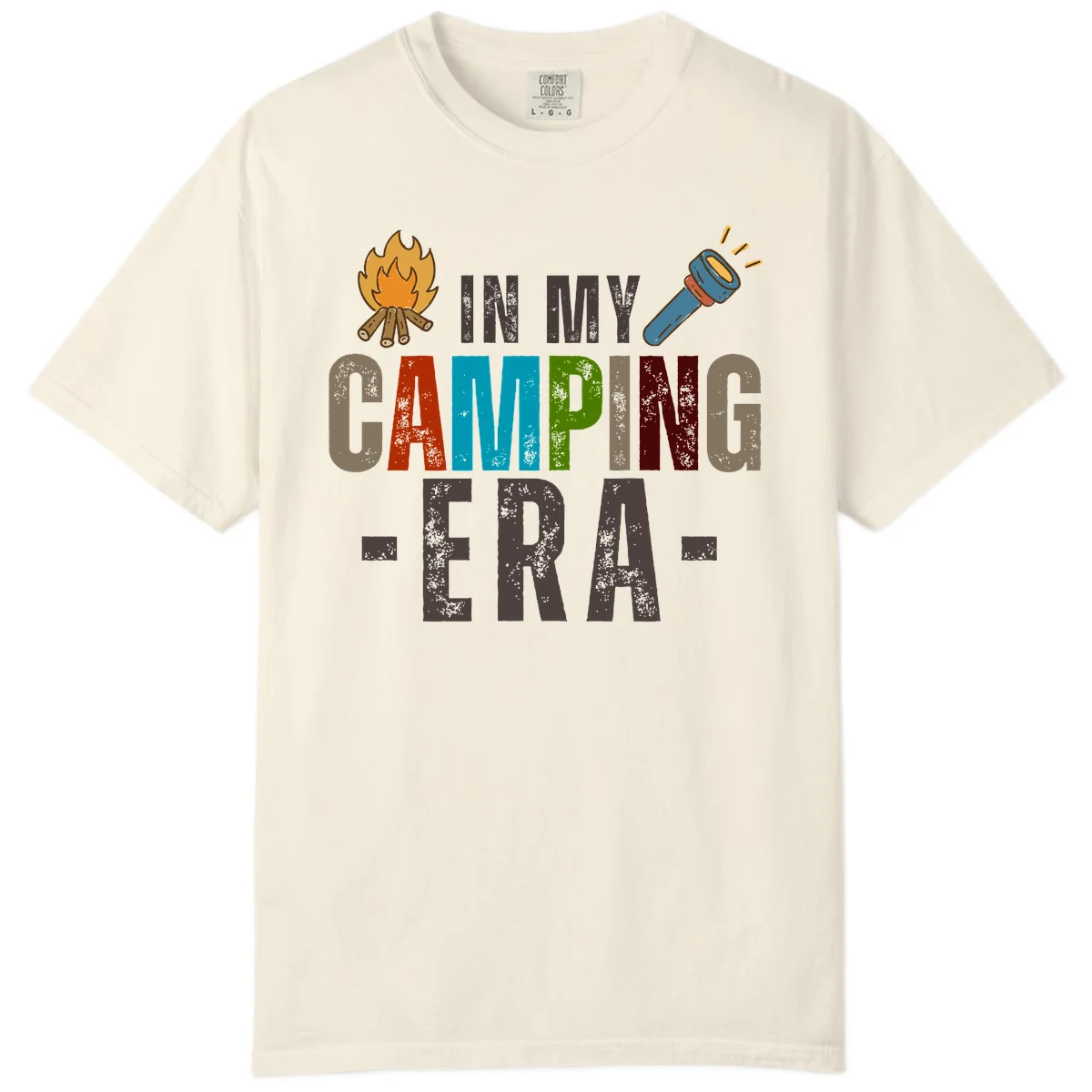 Campfire and flashlight icons flank colorful distressed text reading 'In My Camping Era' on gray background in Ivory