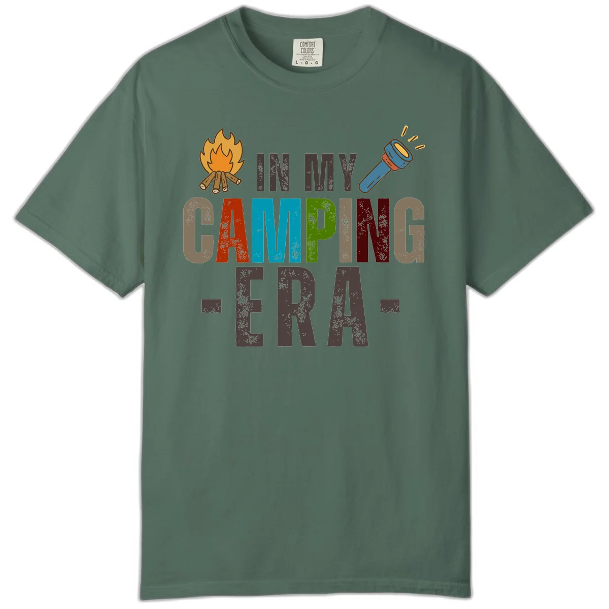 Campfire and flashlight icons flank colorful distressed text reading 'In My Camping Era' on gray background in Blue Spruce