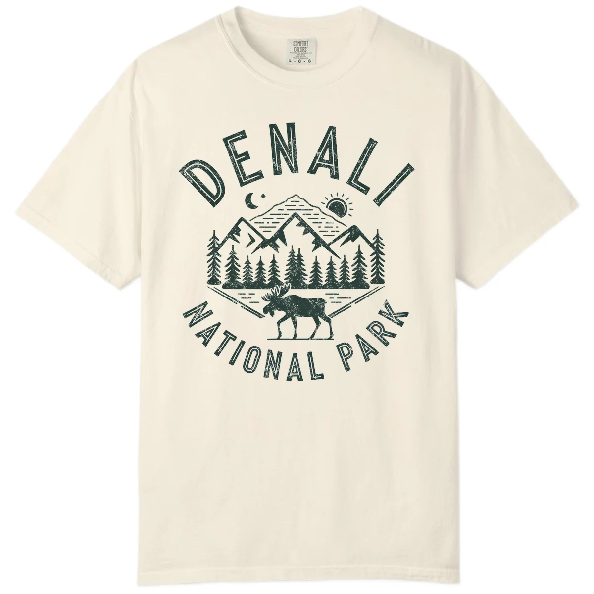 Denial National Park badge design with moose walking through forest, mountains, sun and moon with crossed fishing rods in Ivory