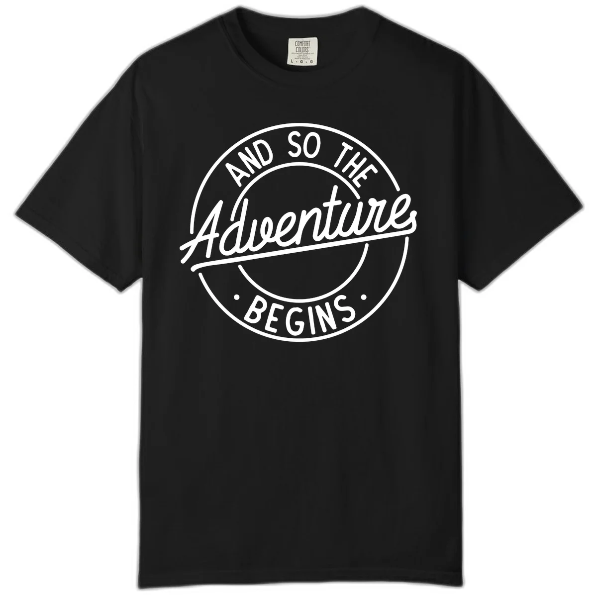 Vintage circular badge design with white text reading 'And So The Adventure Begins' on gray background in Black