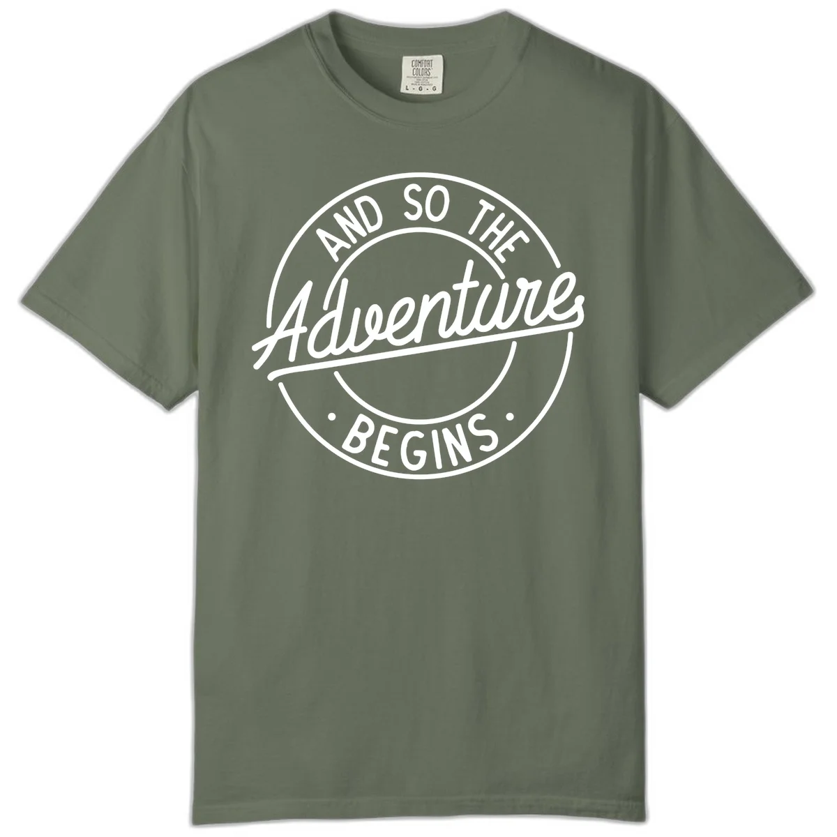 Vintage circular badge design with white text reading 'And So The Adventure Begins' on gray background in Moss