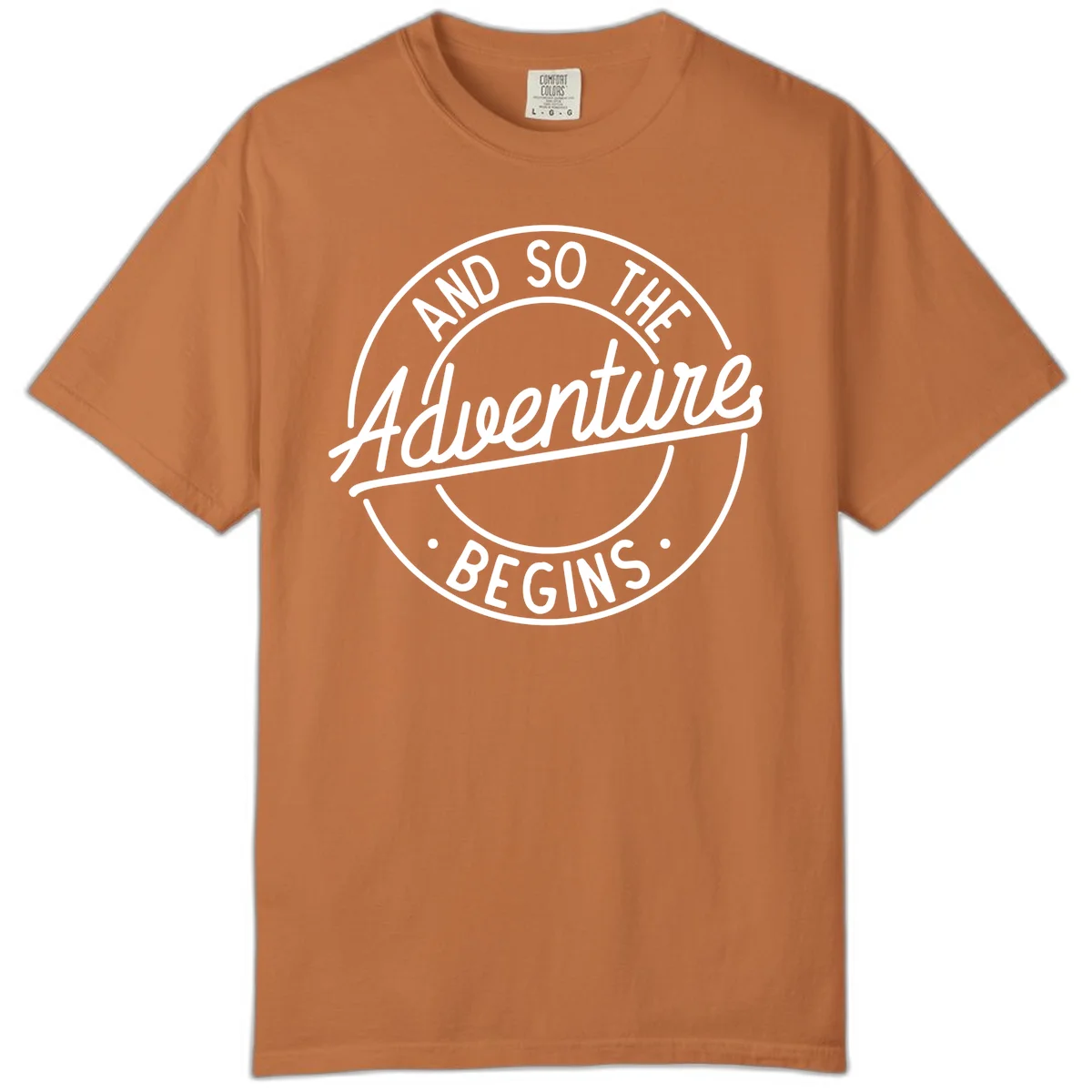 Vintage circular badge design with white text reading 'And So The Adventure Begins' on gray background in Yam