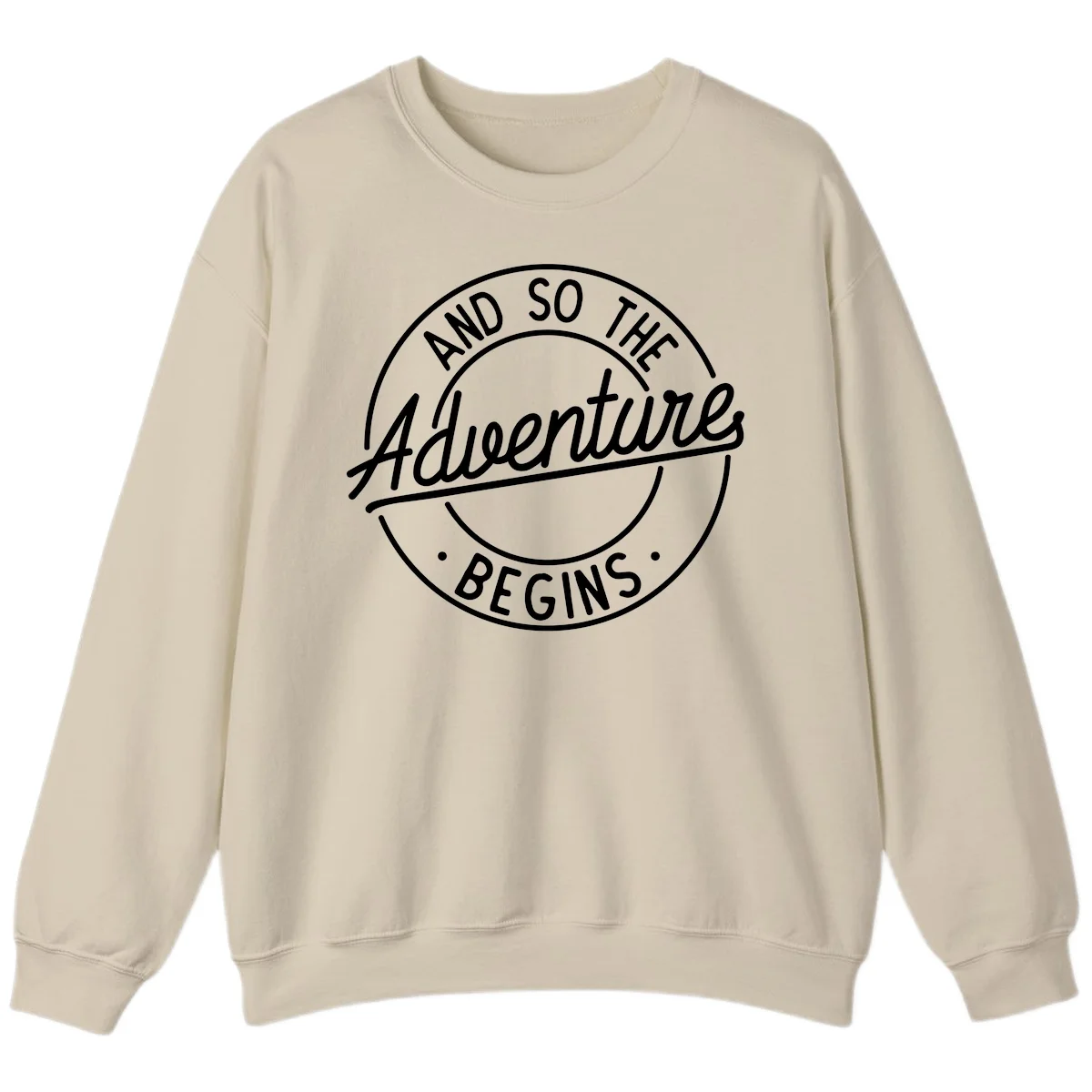 Vintage circular badge design with white text reading 'And So The Adventure Begins' on gray background in Sand
