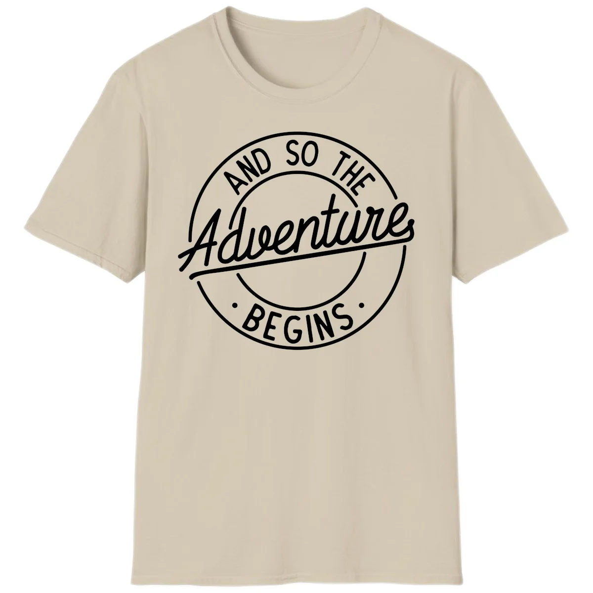 Vintage circular badge design with white text reading 'And So The Adventure Begins' on gray background in Sand